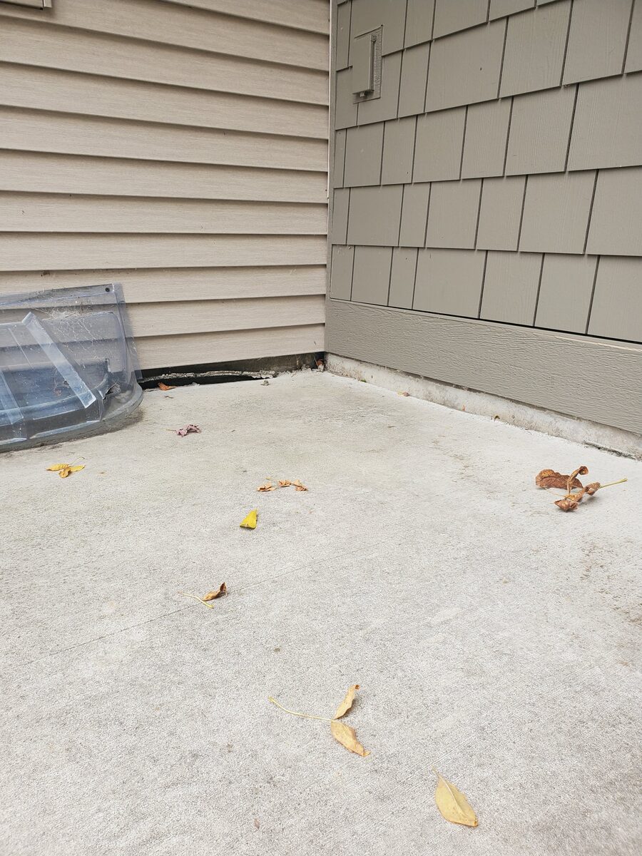 Sunken concrete slab before mudjacking